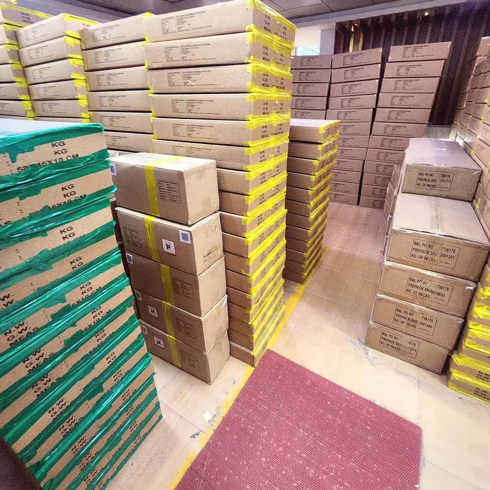 Packed export cartons stacked in a factory finished-goods warehouse