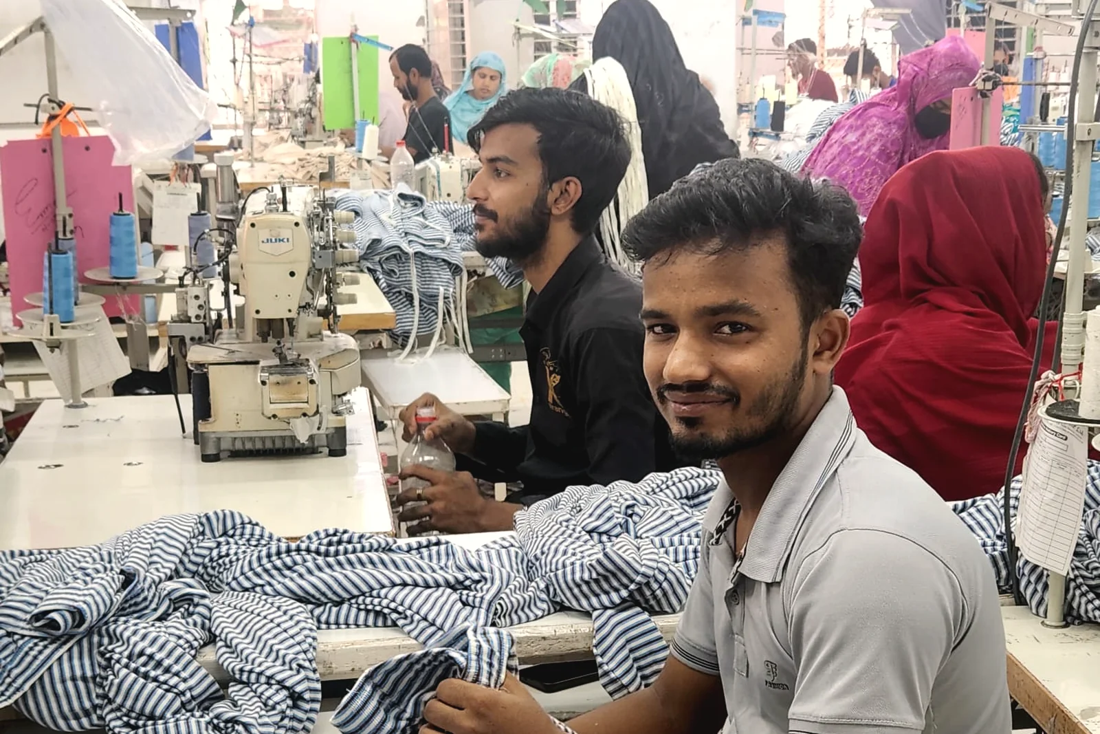 Sewing operators at work on a busy garment production floor in a NorthStar partner factory